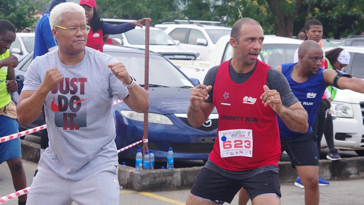 Caz Sales local business owner and fitness fanatic  and Africa Aquatics Zone 4 Bureau MemberHerman Jele (left) in an intense aerobics session following the Charity Run in Manzini.